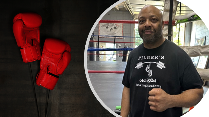 Red boxing gloves next to a trainer making a fist