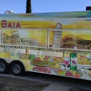 Colorful La Baia food truck with Italian-themed artwork, including landmarks like the Colosseum and Leaning Tower of Pisa, and illustrations of pasta, pizza, and wine. The side reads "From Italy with Love".